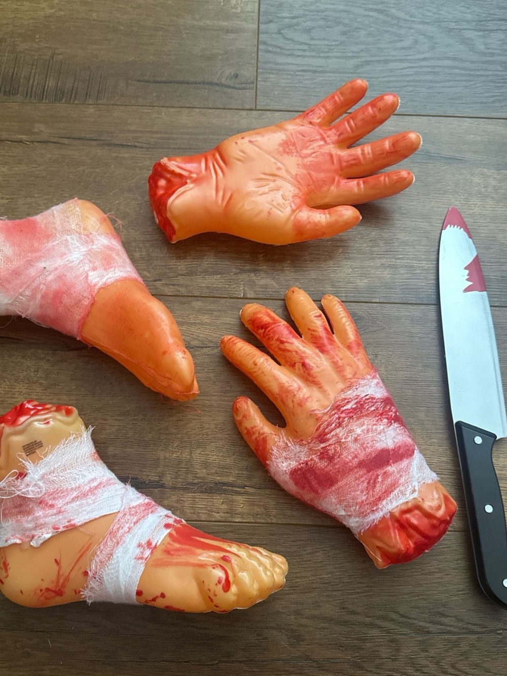 Fake Severed Hand and Foot Halloween Props - Bloody Orange Set